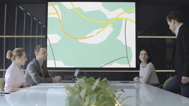 Video Reference: Green, Event, Adaptation, Room, Presentation, Collaboration, Interior design, Plant, Projection screen, Job, Person
