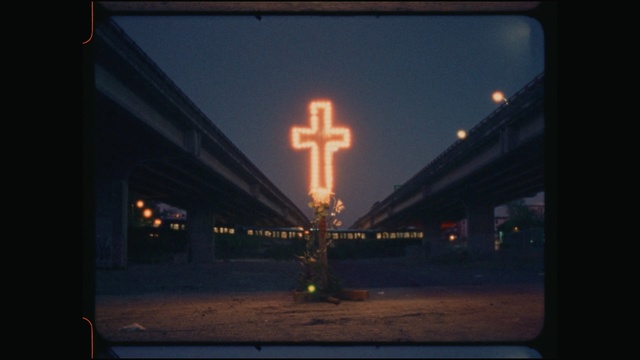 Video Reference: Sky, Light, Cross, Religious item, Lighting, Night, Symbol, Technology, Darkness, Photography
