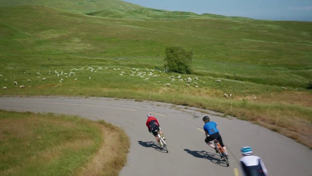 Video Reference: Cycling, Road cycling, Outdoor recreation, Vehicle, Recreation, Bicycle, Natural environment, Grassland, Cycle sport, Endurance sports