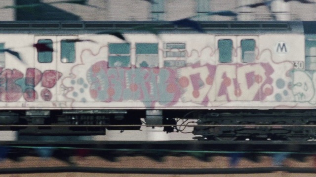 Video Reference: Graffiti, Transport, Rolling stock, Art, Rolling, Vehicle, Railroad car, Street art, Font, Train