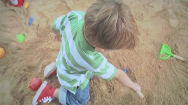 Video Reference: child, play, toddler, sand, soil, material, grass, girl