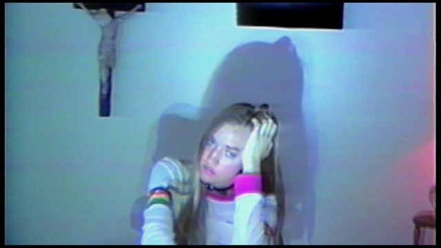 Video Reference: hair, blue, face, black, clothing, purple, facial expression, human hair color, mode of transport, head