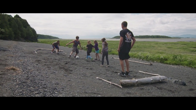 Video Reference: sky, vehicle, fun, sand, water, landscape, recreation, vacation, beach, tree, Person