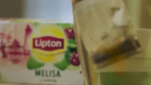 Video Reference: Product, Drink, Font, Junk food, Sweetness, Snack, Bottle, Food, Cup, Indoor, Table, Coffee, Sitting, Cake, Toothbrush, Donut, Desk, Counter, Brush, Glass, Keyboard, Laptop, Computer, Mirror, Plate, White, Sandwich, Teeth, Kitchen, Sink, Soft drink, Text, Juice