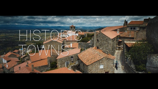 Video Reference: Town, Roof, Property, Human settlement, Sky, Architecture, Urban area, Photography, Aerial photography, City