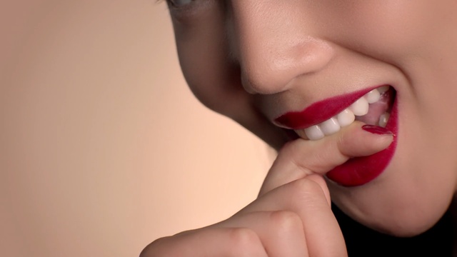 Video Reference: lip, tooth, close up, mouth, chin, nail, smile, finger, hand, jaw