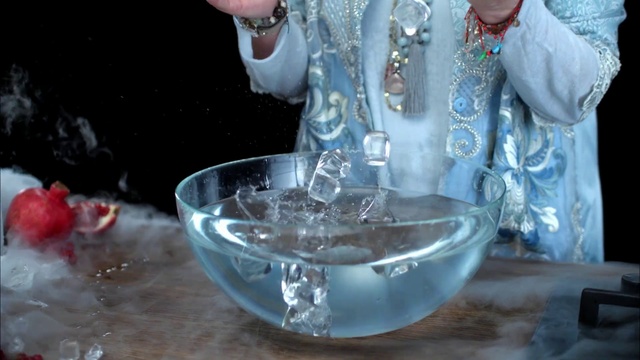 Video Reference: Water, Drinking water, Drink, Glass, Alcohol, Liquid, Ice, Wine glass, Fluid, Person, Table, Cup, Food, Young, Little, Sitting, Man, Wearing, Holding, Boy, Standing, Bowl, Woman, Plate, Eating, People, Sandwich, White, Snow, Tableware, Vase, Transparent material, Bottle