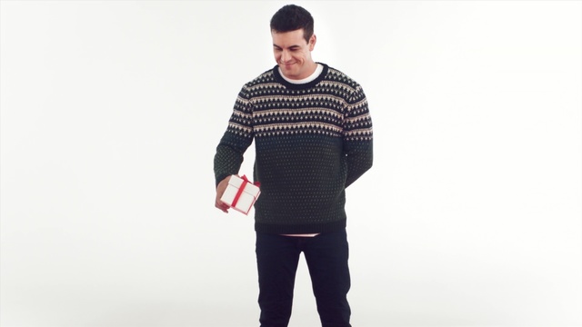 Video Reference: shoulder, sweater, standing, neck, outerwear, sleeve, woolen, pattern, gentleman, product, Person