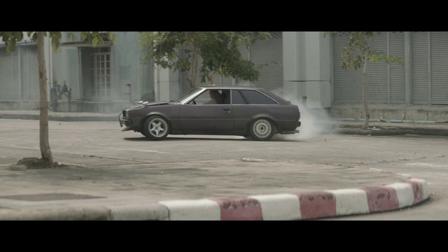 Video Reference: Land vehicle, Vehicle, Car, Drifting, Mode of transport, Sedan, Coupé, Rim, Compact car, Sports car