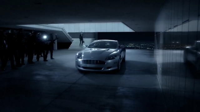 Video Reference: car, motor vehicle, land vehicle, white, black, vehicle, automotive design, luxury vehicle, automotive lighting, mode of transport, Person