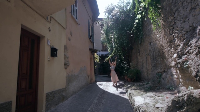 Video Reference: Alley, Street, Road, Town, Property, Neighbourhood, Wall, Infrastructure, Tree, Lane