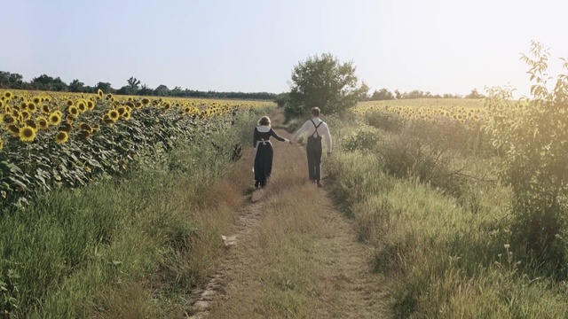Video Reference: Grass, Dirt road, Field, Rural area, Trail, Grass, Grassland, Road, Plant community, Meadow, Person