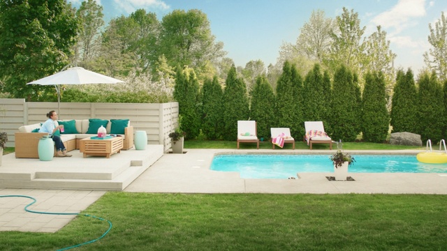 Video Reference: swimming pool, property, leisure, backyard, yard, estate, grass, house, real estate, home, Person
