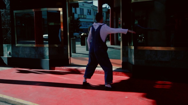 Video Reference: red, light, snapshot, standing, lighting, darkness, night, performance art, fun, performance, Person