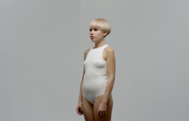 Video Reference: fashion model, human hair color, model, standing, shoulder, undergarment, neck, girl, photo shoot, lingerie, Person