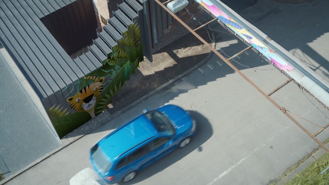 Video Reference: blue, car, mode of transport, motor vehicle, vehicle, automotive exterior, house, roof, window, compact car
