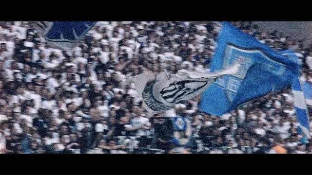 Video Reference: Blue, Sky, Jersey, Font, Sportswear, Textile, T-shirt, World, Shoe, Crowd