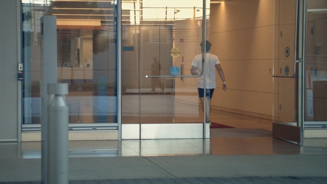 Video Reference: glass, door, window, floor, flooring, Person