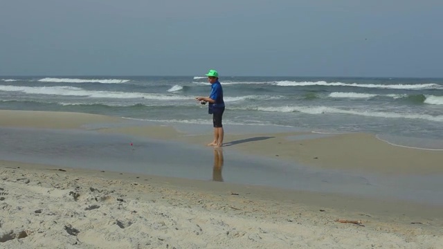 Video Reference: Shore, Beach, Wave, Coast, Water, Ocean, Sea, Natural environment, Vacation, Sand, Person