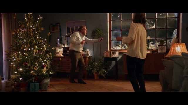 Video Reference: Photograph, Social group, Snapshot, Lighting, Event, Fun, Christmas, Tree, Darkness, Human body, Person, Indoor, Playing, Room, Living, Standing, Game, Man, Video, Group, Front, People, Woman, Holding, Young, Sitting, Table, Girl, Wii, Floor, Clothing, Houseplant