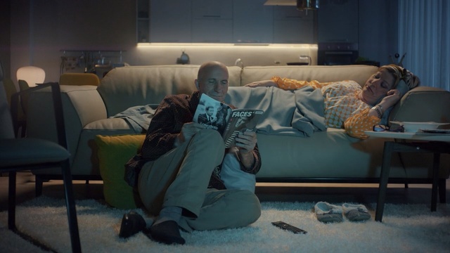 Video Reference: blue, room, sitting, snapshot, couch, furniture, house, screenshot, scene, darkness, Person