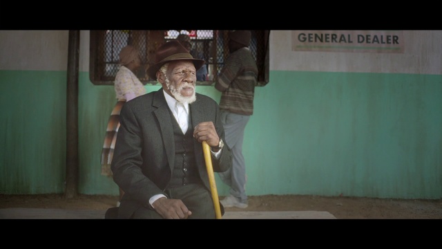 Video Reference: Green, Snapshot, Suit, Human, Fun, Screenshot, Formal wear, Photography, Photo caption, Movie