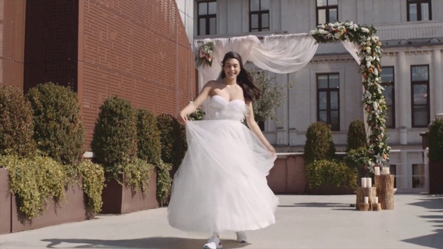 Video Reference: Bride, Gown, Wedding dress, Dress, Photograph, Clothing, Bridal clothing, White, Bridal accessory, Shoulder