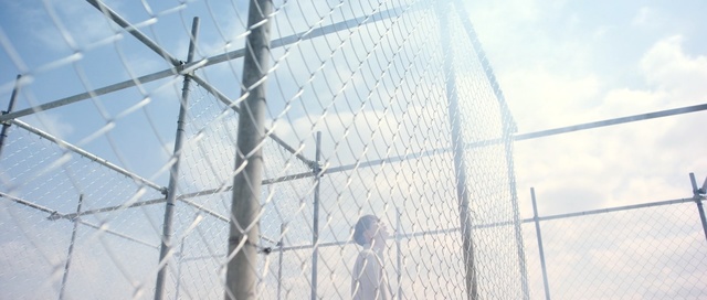 Video Reference: sky, net, structure, energy, mast, public utility, overhead power line, wire fencing, electrical supply, wind, Person