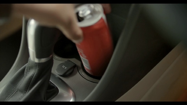 Video Reference: car, red, automotive design, vehicle, gear shift, hand, seat belt, finger, vehicle door, automotive exterior