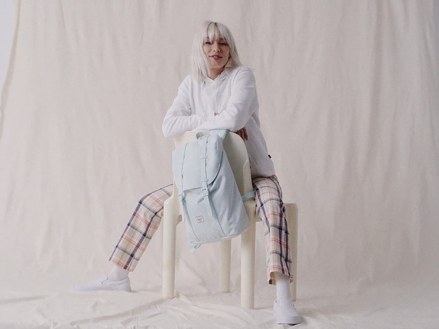 Video Reference: White, Clothing, Fashion, Outerwear, Trench coat, Robe, Shoulder, Coat, Leg, Fashion design, Person