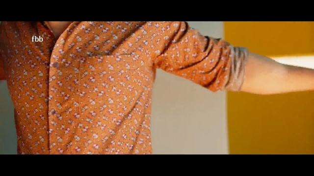 Video Reference: orange, dress, shoulder, back, pattern, arm, design, finger, hand, neck, Person