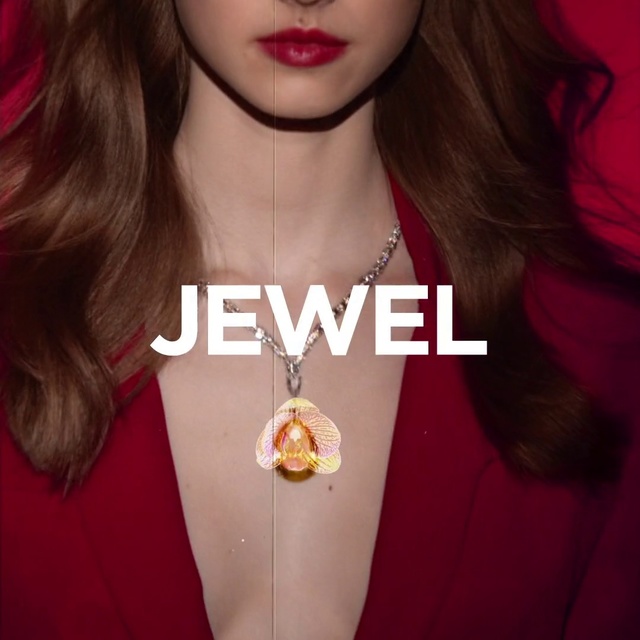 Video Reference: Hair, Red, Lip, Pendant, Necklace, Jewellery, Fashion accessory, Yellow, Beauty, Skin, Person, Woman, Indoor, Girl, Shirt, Holding, Young, Wearing, Standing, White, Looking, Posing, Front, Black, Close, Hat, Lipstick, Human face