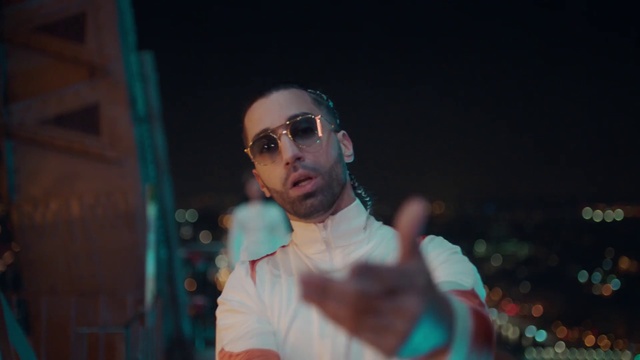 Video Reference: Eyewear, Cool, Fun, Glasses, Human, Sunglasses, Photography, Performance, Vision care, Night, Person, Man, Holding, Looking, Standing, Shirt, Wearing, Young, Playing, Blue, White, Room, Phone, Court, Remote, Video, Ball, Player, Human face, Clothing, Goggles