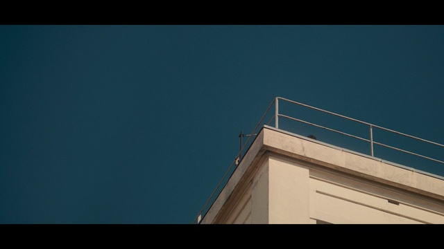 Video Reference: Blue, Sky, Black, Architecture, Daytime, Line, Cloud, Window, House, Building