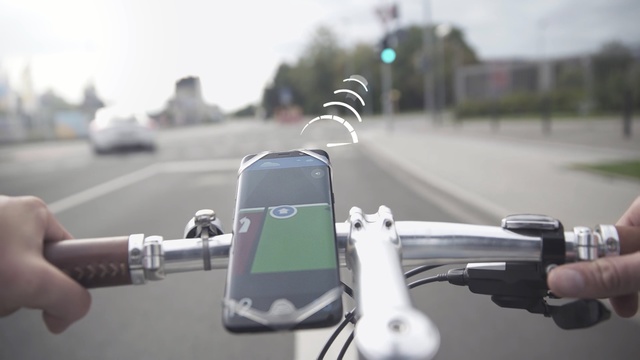 Video Reference: vehicle, car, technology, bicycle accessory, bicycle, motor vehicle, hand, sports equipment, Person