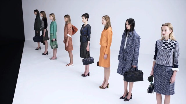 Video Reference: Fashion, Fashion model, Clothing, Fashion design, Standing, Runway, Design, Event, Fashion show, Outerwear, Person