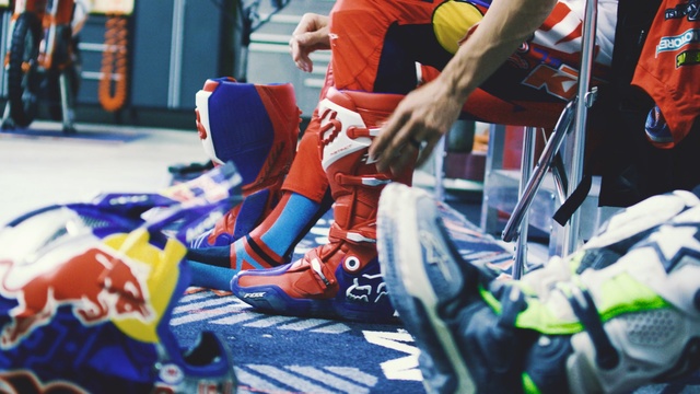 Video Reference: car, personal protective equipment, product, competition event, team sport, helmet, race, recreation, protective gear in sports, championship