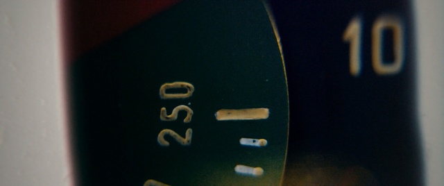 Video Reference: Text, Yellow, Font, Number, Macro photography, Photography, Technology, Close, Sitting, Black, Cup, Blue, Food, Table, Red, Sign, White