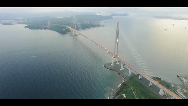 Video Reference: aerial photography, bridge, fixed link, waterway, water resources, bird's eye view, sea, sky, suspension bridge, water