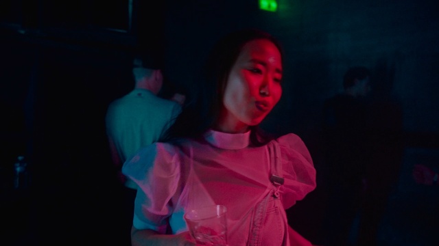 Video Reference: Entertainment, Red, Magenta, Pink, Performance, Fun, Darkness, Performance art, Music, Performing arts, Person