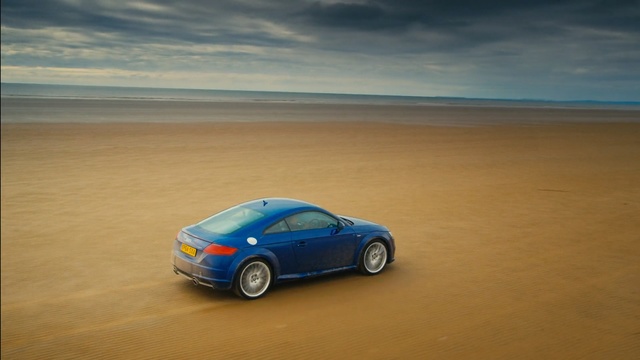 Video Reference: car, desert, blue, sky, automotive design, sports car, mode of transport, motor vehicle, vehicle, reflection, luxury vehicle, desert, sands, sand, flat