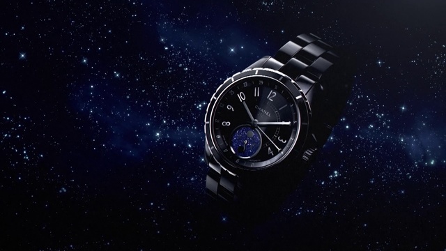 Video Reference: Watch, Analog watch, Space, Sky, Constellation, Watch accessory, Astronomical object, Fashion accessory, Electric blue, Outer space, Clock, Object, Thing, Sitting, Light, Dark, Black, Photo, Table, Surface, Lit, Time, White, Monitor, Room, Night, Blue, Water, Large, Tower, Red, Standing, Astronomy