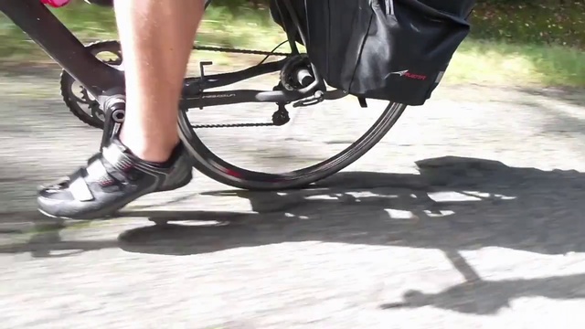 Video Reference: Leg, Footwear, Shoe, Human leg, Ankle, Thigh, Wheel, Vehicle, Foot, Bicycle