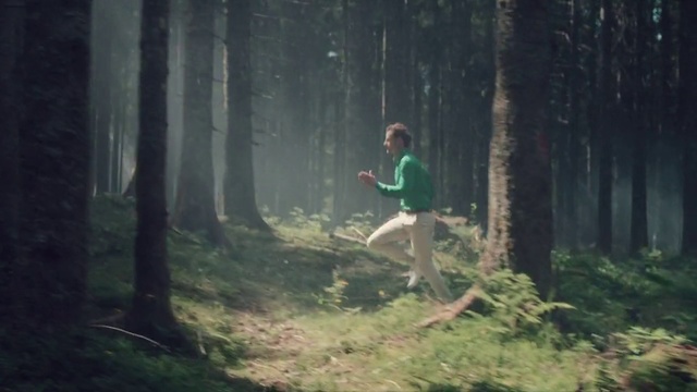 Video Reference: Woodland, Forest, Nature, Natural environment, Old-growth forest, Green, Tree, Jungle, Wilderness, Atmospheric phenomenon, Person, Outdoor, Grass, Man, Air, Jumping, Young, Riding, Flying, Park, Board, Hill, Shirt, Night, Frisbee, Doing, Holding, Standing, Game, Hiking, Clothing