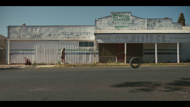 Video Reference: Sky, Building, Asphalt, Rural area, Facade, Road surface, Landscape, City, Road, Commercial building