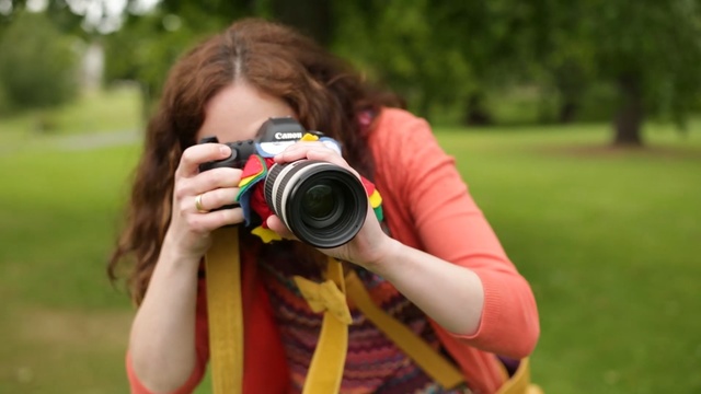 Video Reference: photographer, photograph, yellow, grass, photography, camera lens, camera, single lens reflex camera, cameras & optics, digital slr, Person