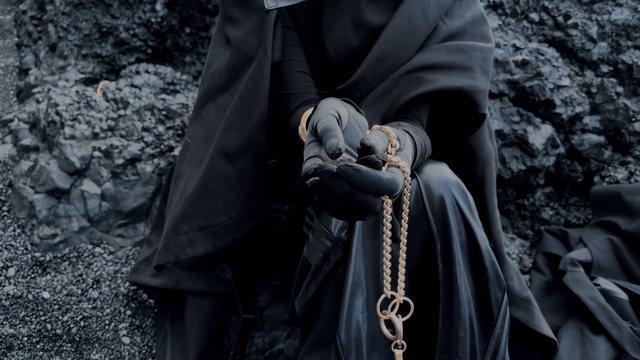 Video Reference: Outerwear, Vertebrate, Human, Textile, Temple, Gesture, Black-and-white, Grey, Style, Monochrome photography