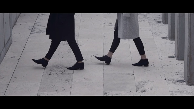 Video Reference: footwear, white, black, photograph, shoe, leg, snapshot, standing, human leg, black and white, Person