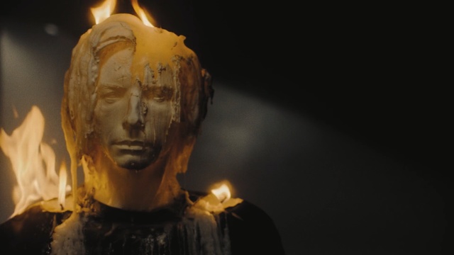 Video Reference: Sculpture, Head, Art, Lighting, Human, Statue, Carving, Building, Dark, Front, Sitting, Black, Standing, Man, Table, Lit, Cake, Street, Food, Holding, Dog, Yellow, Night, People, Human face, Face