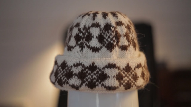 Video Reference: Clothing, Knit cap, Beanie, Cap, Headgear, Wool, Hat, Beige, Fashion accessory, Costume accessory, Person